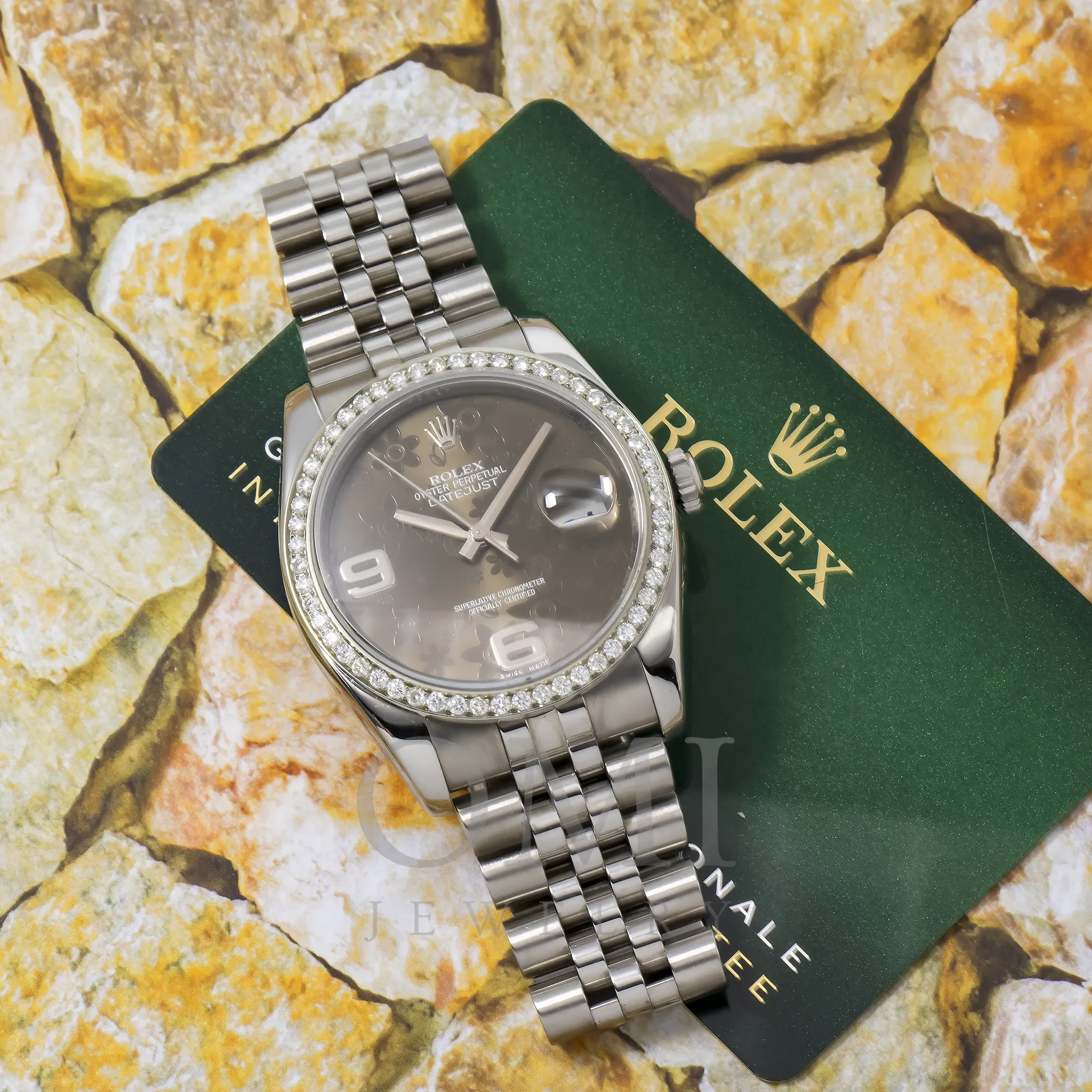 ROLEX DATEJUST 116234 36MM JUBILLE BRACELET WITH BLACK FLORAL DIAL AND DIAMOND BEZEL.